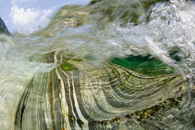 Inside a waterfall in the Verzasca River
