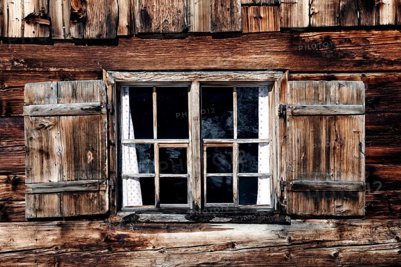 Old wooden window of a mountain hut