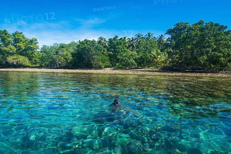 Man snorkeling in the clear waters