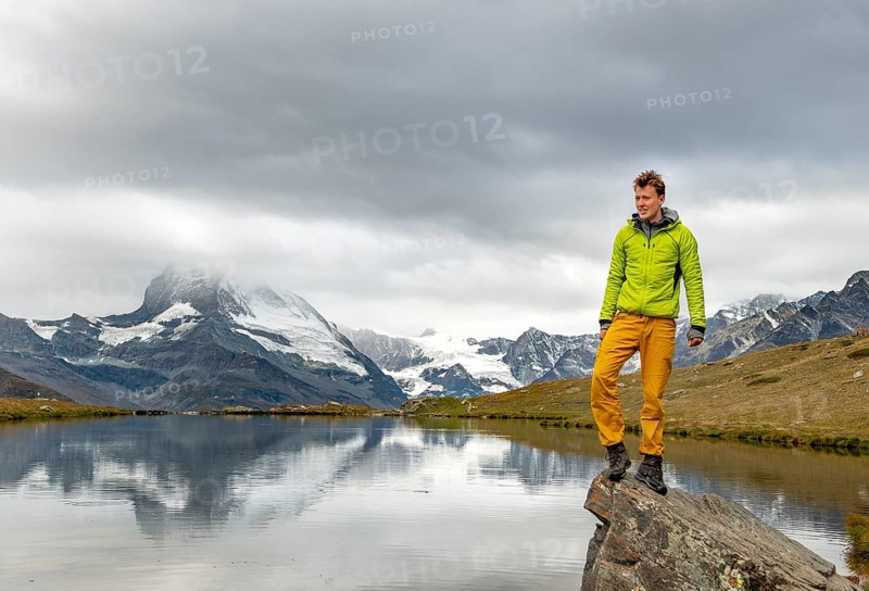 Hiker stands on rock