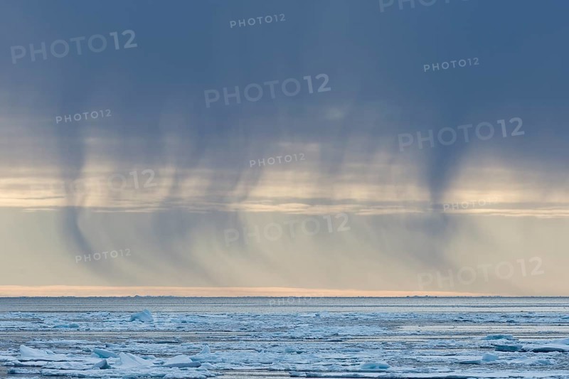 Snow shower from dark clouds