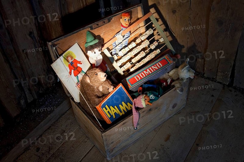 Old toys in a wooden chest