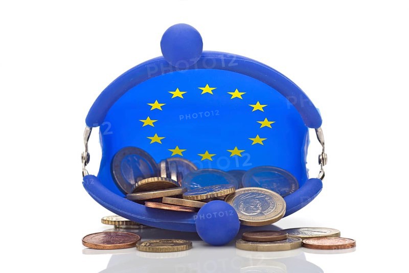 European coins in a blue purse with euro-stars