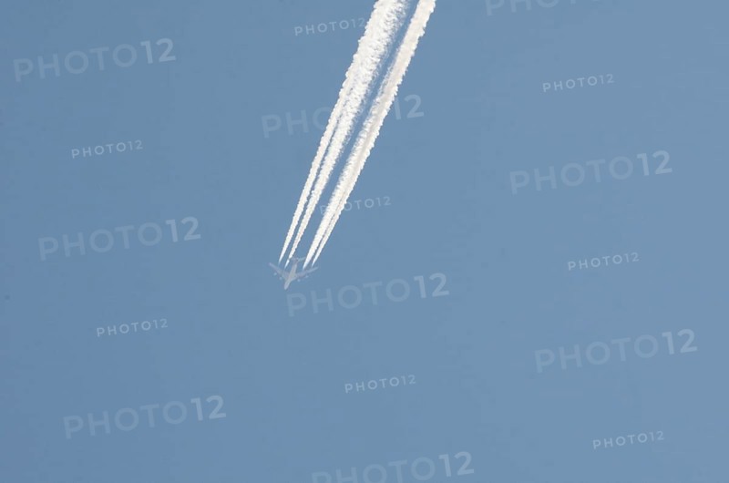 Contrails left by a four-engine airliner