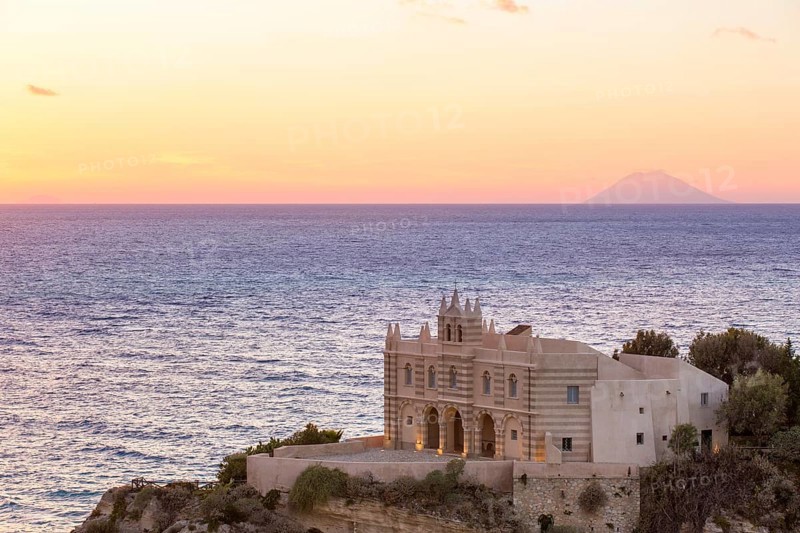 Church Chiesa Santa Maria dell'Isola behind the Stromboli volcano