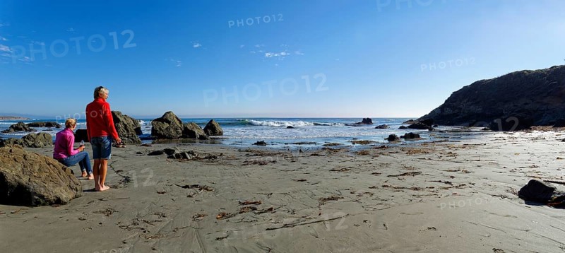 Two women on the sandy beach