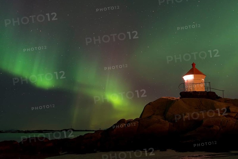 Northern Lights over a lighthouse