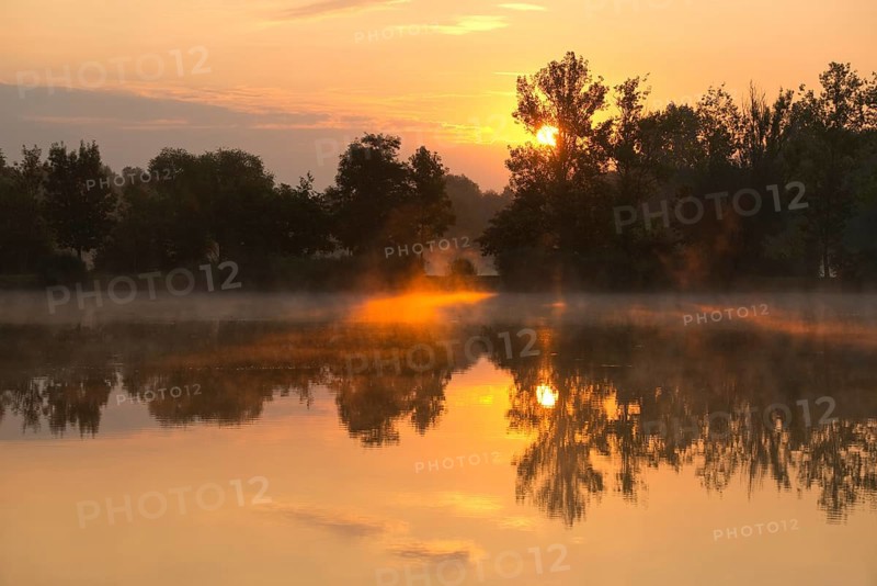 Sunrise over a pond