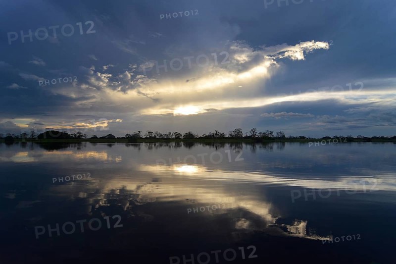 Dusk at a lake-like widened part of the Amazon or Rio Solimoes