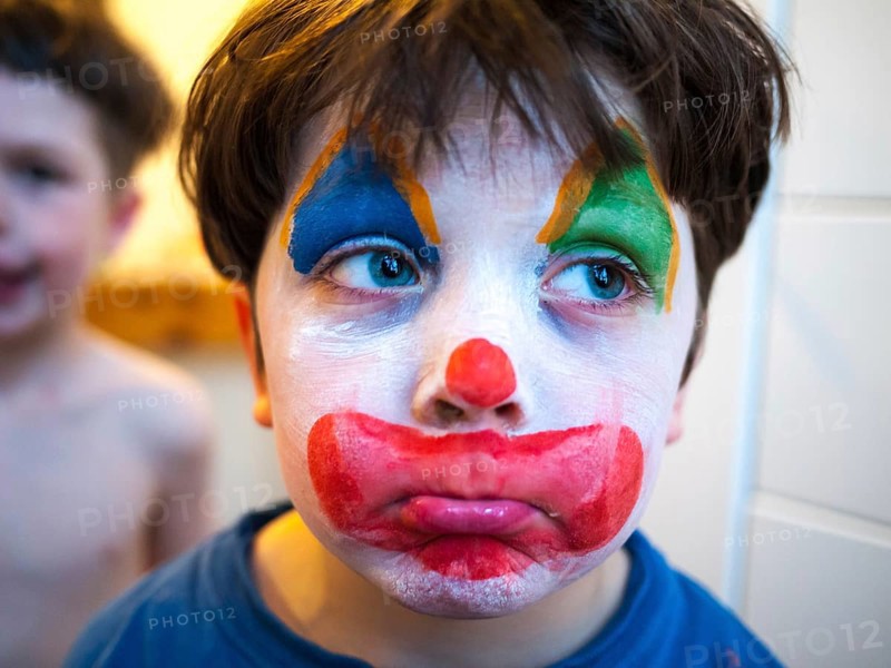 Child with a clown makeup