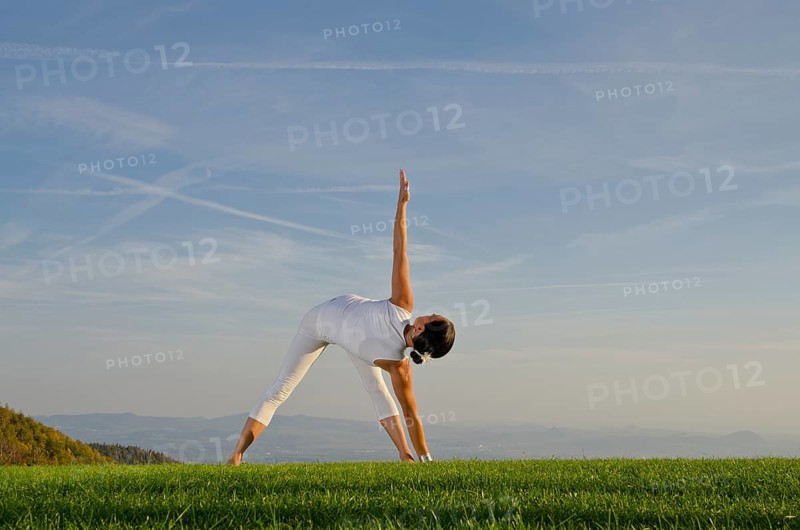 Young woman practising Hatha yoga