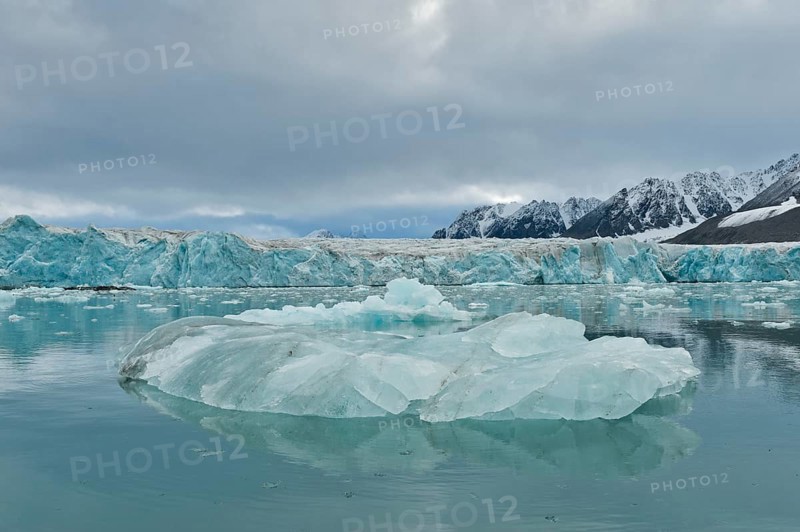 An iceberg and the escarpment of the glacier