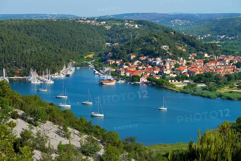 Townscape with sailing ships in the foreground