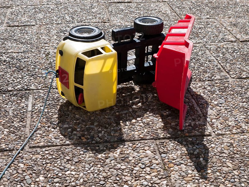 Toppled over toy dumper truck