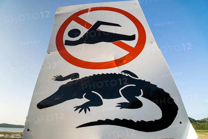 Warning sign for crocodiles and swimming ban