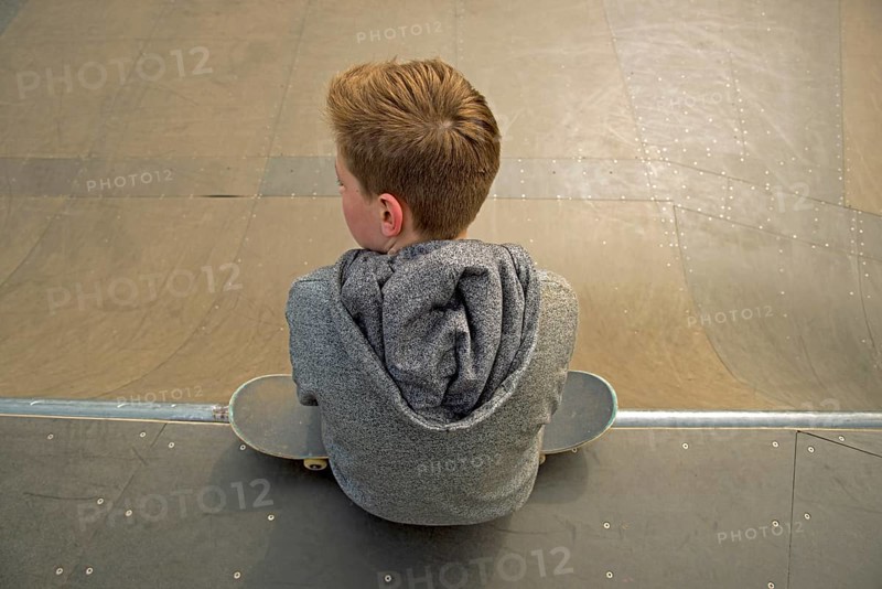 Thirteen-year-old boy with skateboard