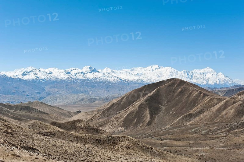 Vast landscape with the snow-covered mountains of the Annapurna Range at back