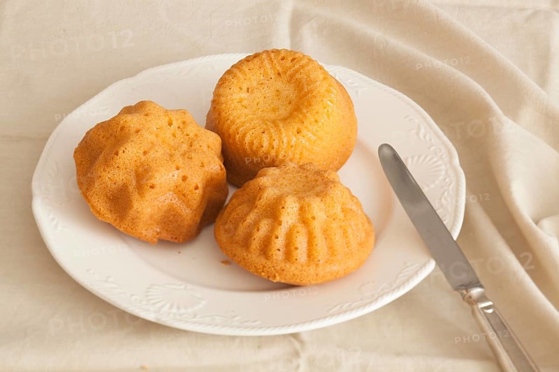 Three items of polenta made from cornmeal baked in ramekins