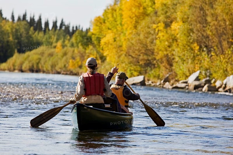 Men rowing a canoe