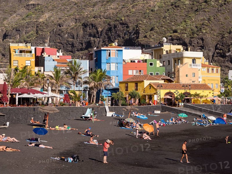 Tourists on the black beach of Puerto de Tazacorte