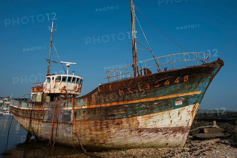 Wreck of an old painted wooden ship