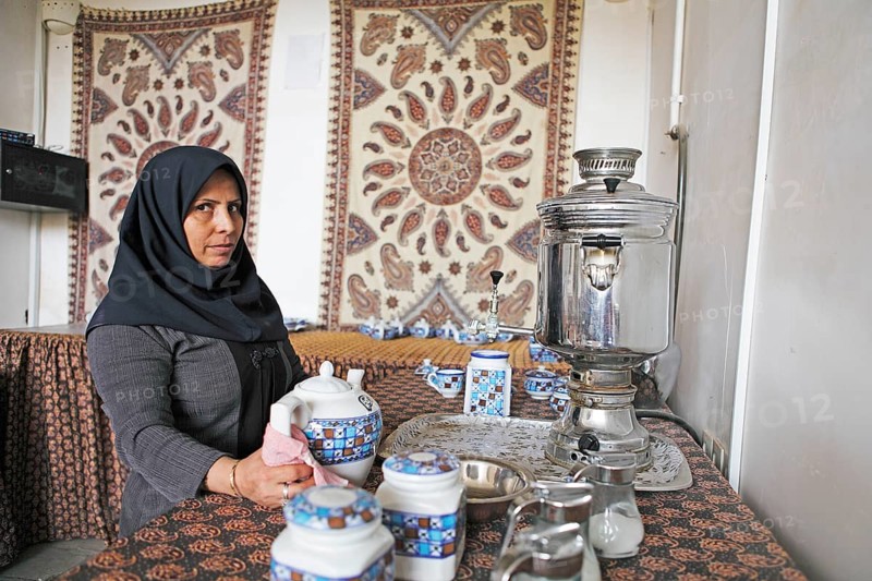 Woman preparing Iranian tea