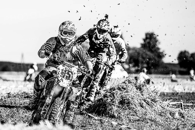 Motocross riders on a field