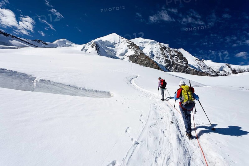 Mountain climbers ascending to Piz Palu Mountain