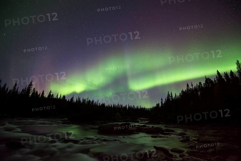 Northern lights or aurora borealis over river