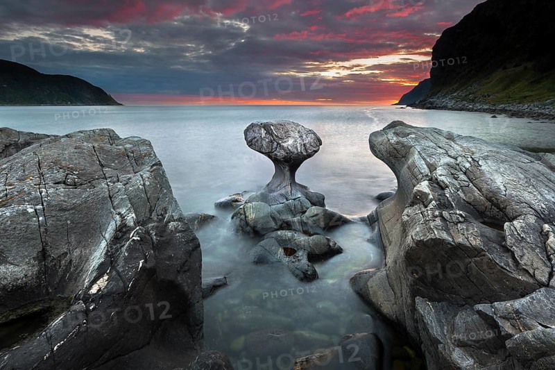 Kannestein or Kanne Stone with coastline at sunset