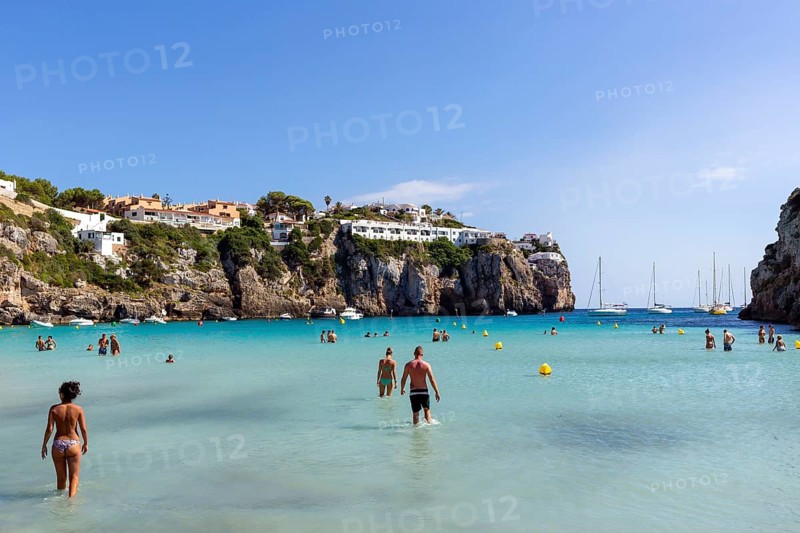 Tourists in the shallow sea