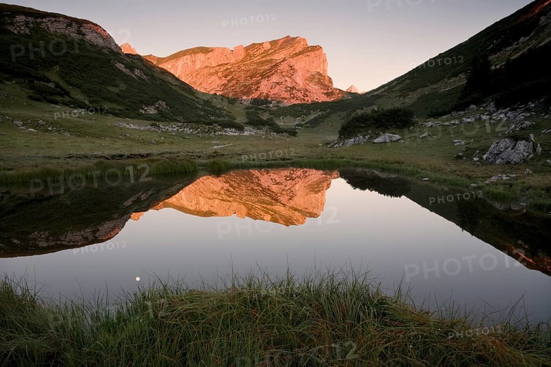 Rofanspitze peak at dawn reflected in Zireiner See