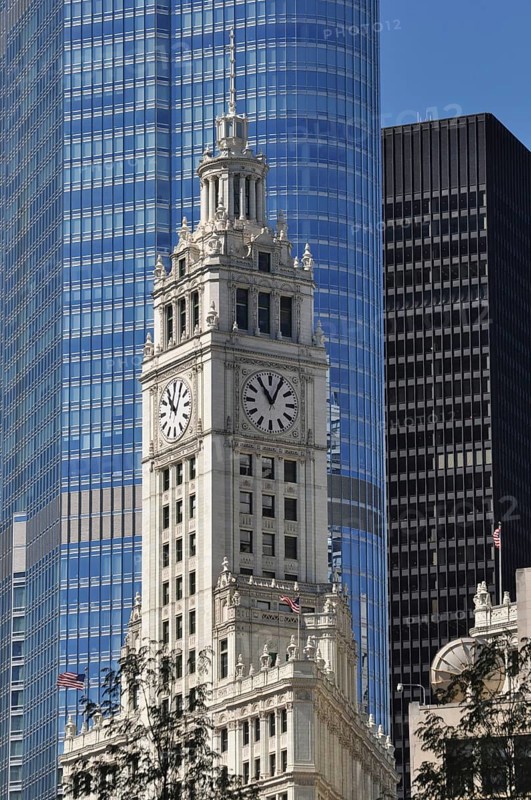 Clock tower of the Wrigley Buildingin the glass facade of Trump International Hotel and Tower