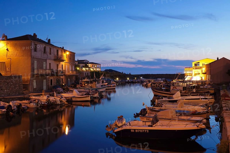 Boats in the harbor at dusk