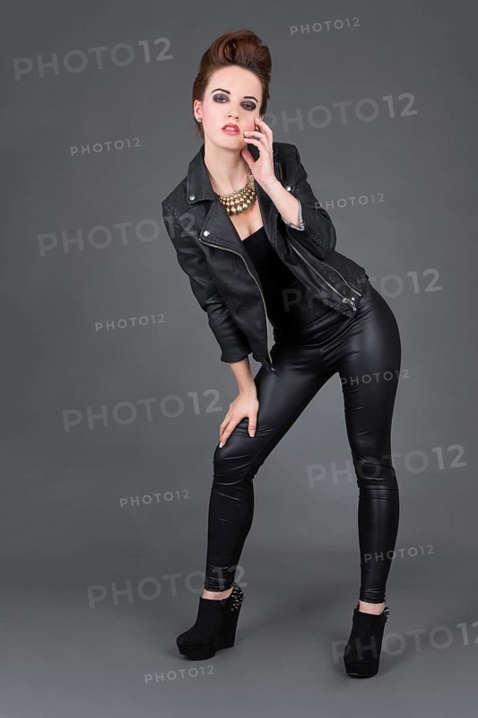 Young woman wearing a leather outfit