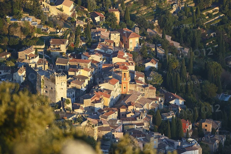 Roquebrune village with its medieval castle and church in the evening light
