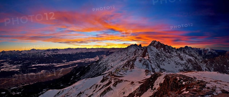Hafelekar station of the Nordkettenbahnen cable car during a dramatic sunset with Mt Brandjochspitze in the back