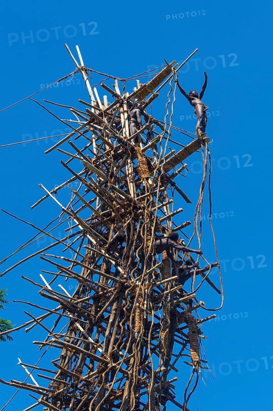 Man jumping from a bamboo tower
