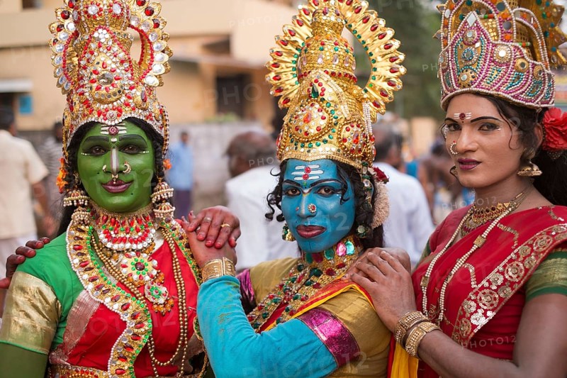 Hindu temple dancers wearing makeup and gold jewelry
