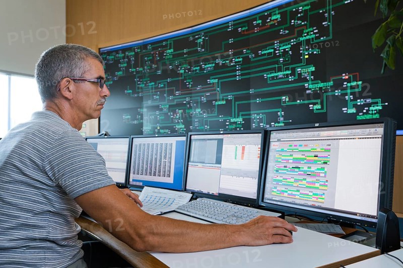 Engineer sitting at his work station in the Transmission Control Center
