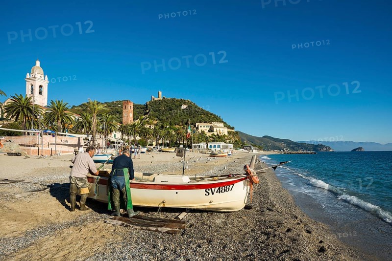 Fishermen with a fishing boat on the beach of Noli