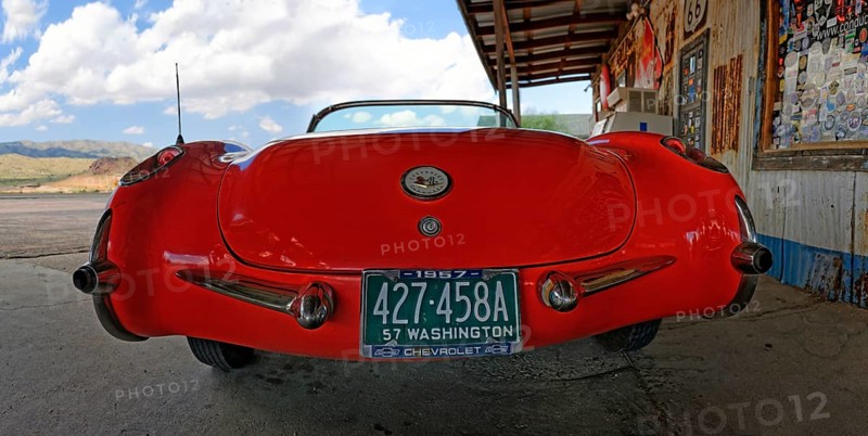 Rear view of a red vintage Chevrolet Corvette Convertible 1957