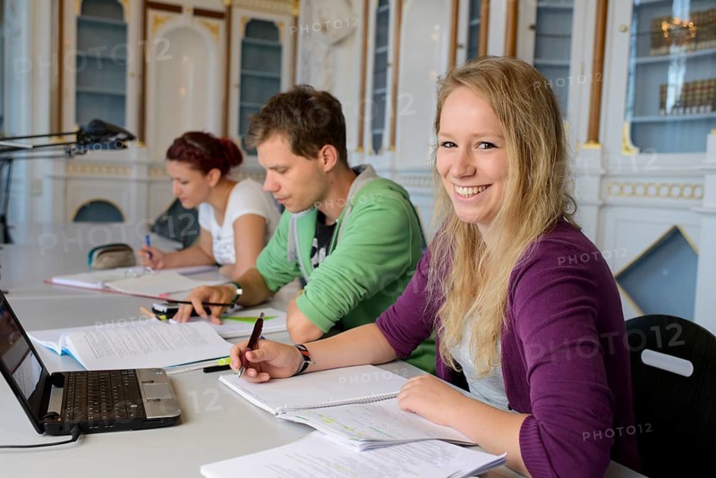 Students studying in the departmental library of the University of Hohenheim in Schloss Hohenheim Palace