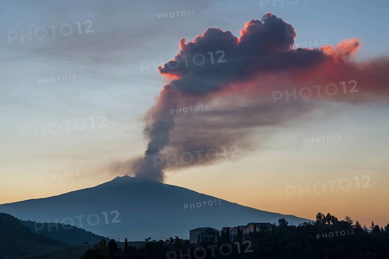 Eruption column above the new southeast crater at sunrise