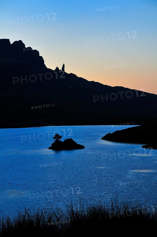 View at dusk across Loch Fada to The Storr with the Old Man of Storr pinnacle