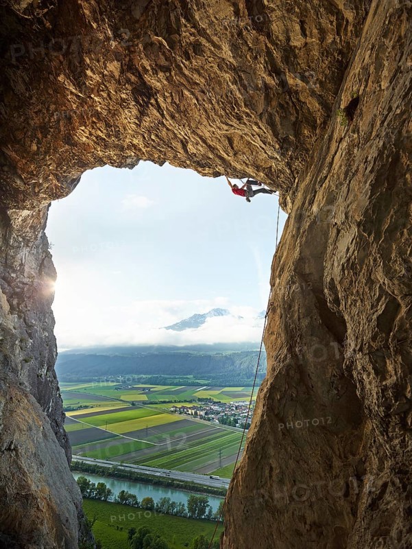 Sport climber climbing in a cave