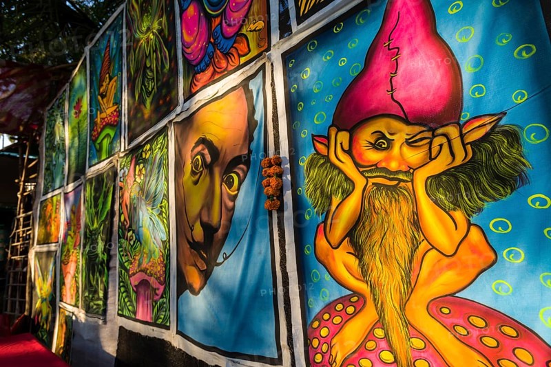 Colourful paintings on cotton sheets for sale at the weekly flea market