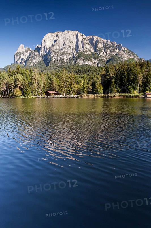 Lago di Fie lake in front of Sciliar Mountain