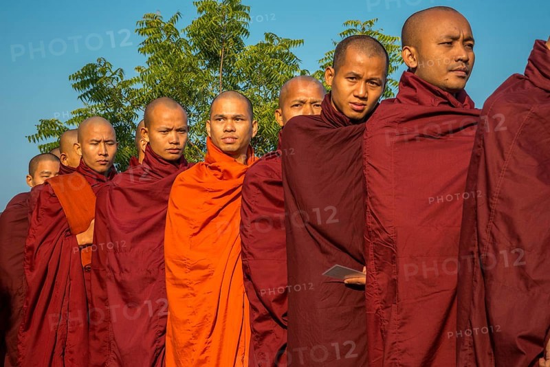 Buddhist monks collecting alms at the temple