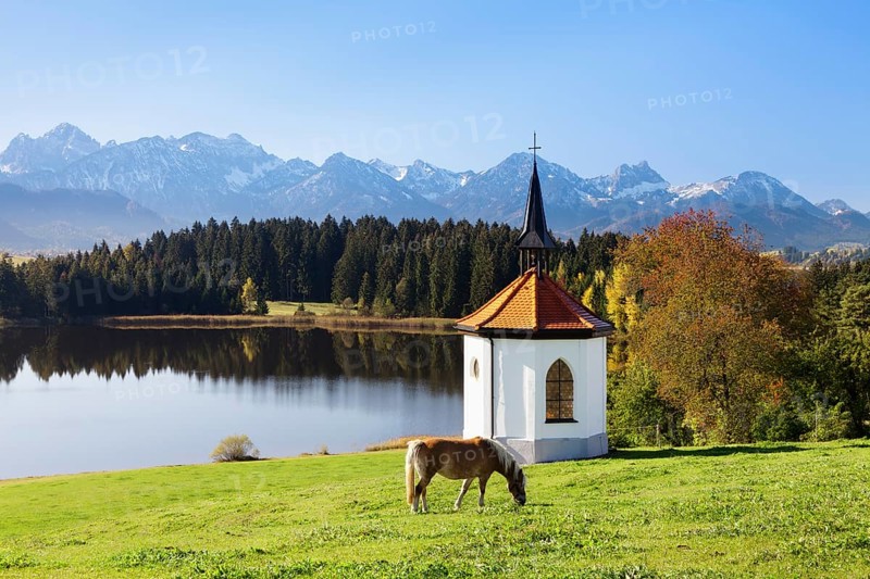 Chapel on Lake Hergratsried with Allgau Alps